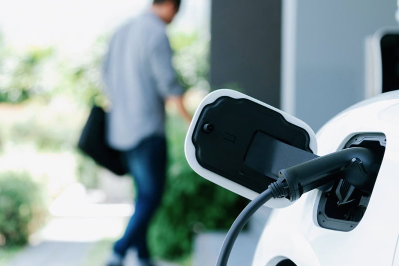 5 Reasons to Install a Home EV Charging Station. Photo of an electrical car being charged by an EV Charging Station.